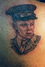 black and gray portrait tattoo