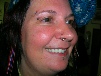 vertical labret, eyebrow and nostril piercing